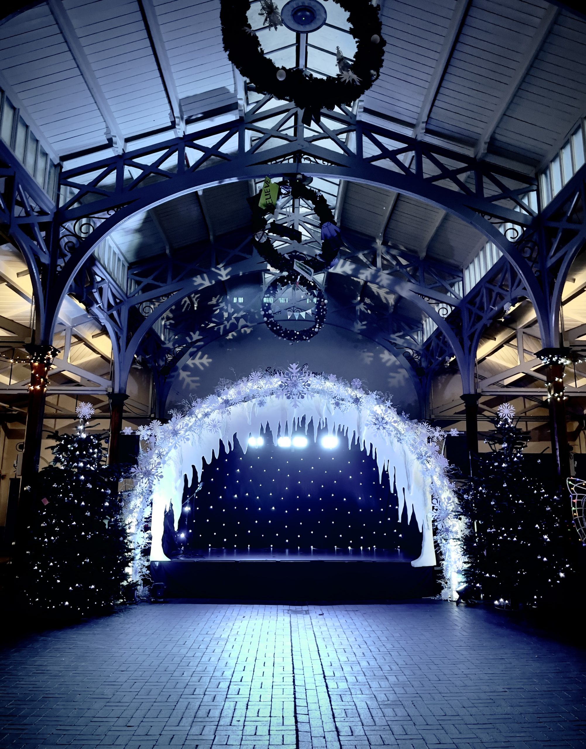 Pop-up stages, sound, lighting, and scenic builds for town centres and holiday centerpieces